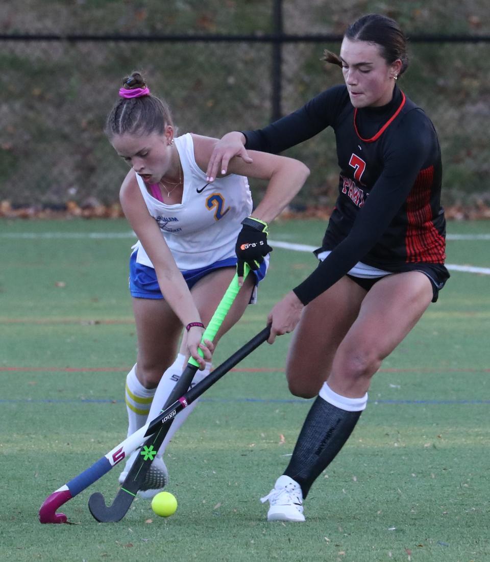 Pawlng's Veronica Webber, left, pressures the ball during a Section 1 Class C field hockey semifinal on Oct. 23, 2023.