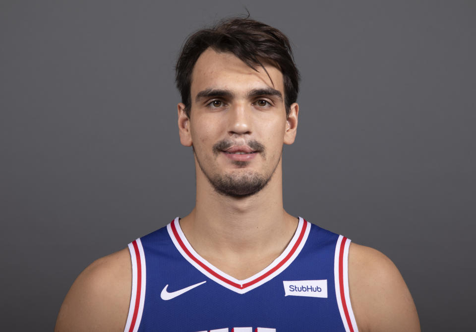 File-This Sept. 21, 2018, file photo shows Philadelphia 76ers' Dario Saric, of Croatia, posing for a photograph during media day at the NBA basketball team's practice facility, in Camden, N.J. Jimmy Butler is headed to Philadelphia, ending the weeks-long saga of him wanting out of Minnesota. A person with knowledge of the situation says Butler is being traded to the 76ers in a package that will send Saric and Robert Covington to the Timberwolves. (AP Photo/Chris Szagola, File)