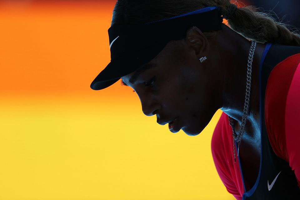 Serena Williams prepares for a point during her Australian Open semifinal match against Naomi Osaka.