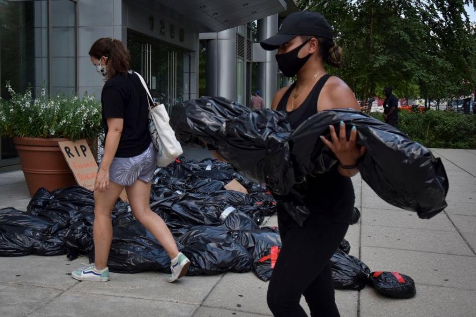 July 27: Members of the Washington D.C. teachers union bring mock body bags to DCPS headquarters depicting what they say will happen if schools reopen. (Getty Images)