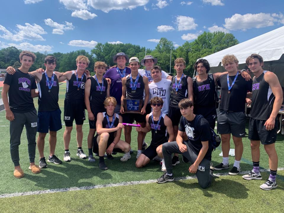 The Rumson-Fair Haven boys track team with the Central Group 2 trophy