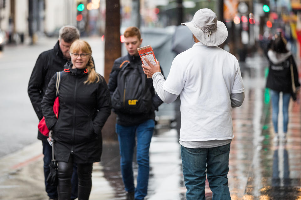 HOLLYWOOD, CALIFORNIA - MARCH 13: A tour vendor approaches pedestrians on March 13, 2020 in Hollywood, California. The spread of COVID-19 has negatively affected a wide range of industries all across the global economy. (Photo by Rich Fury/Getty Images)