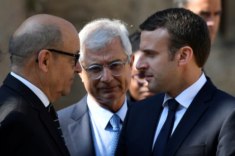 French Defence Minister Jean-Yves Le Drian (L) is expected to be the only member of the unloved outgoing Socialist government to remain