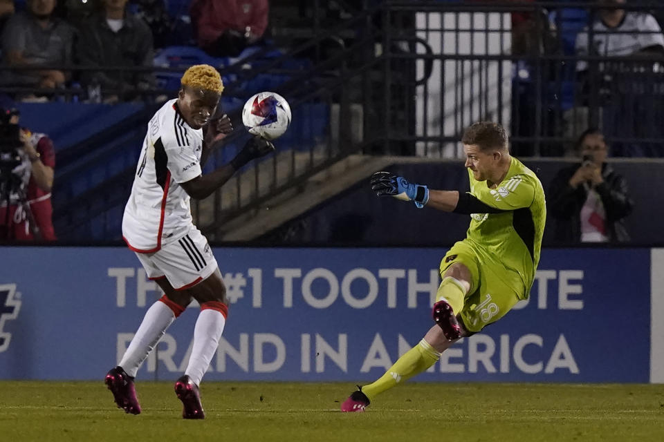 Real Salt Lake goalkeeper Zac MacMath (18) kicks the ball against FC Dallas forward Bernard Kamungo, left, during the second half of an MLS soccer match Saturday, April 15, 2023, in Frisco, Texas. (AP Photo/LM Otero)