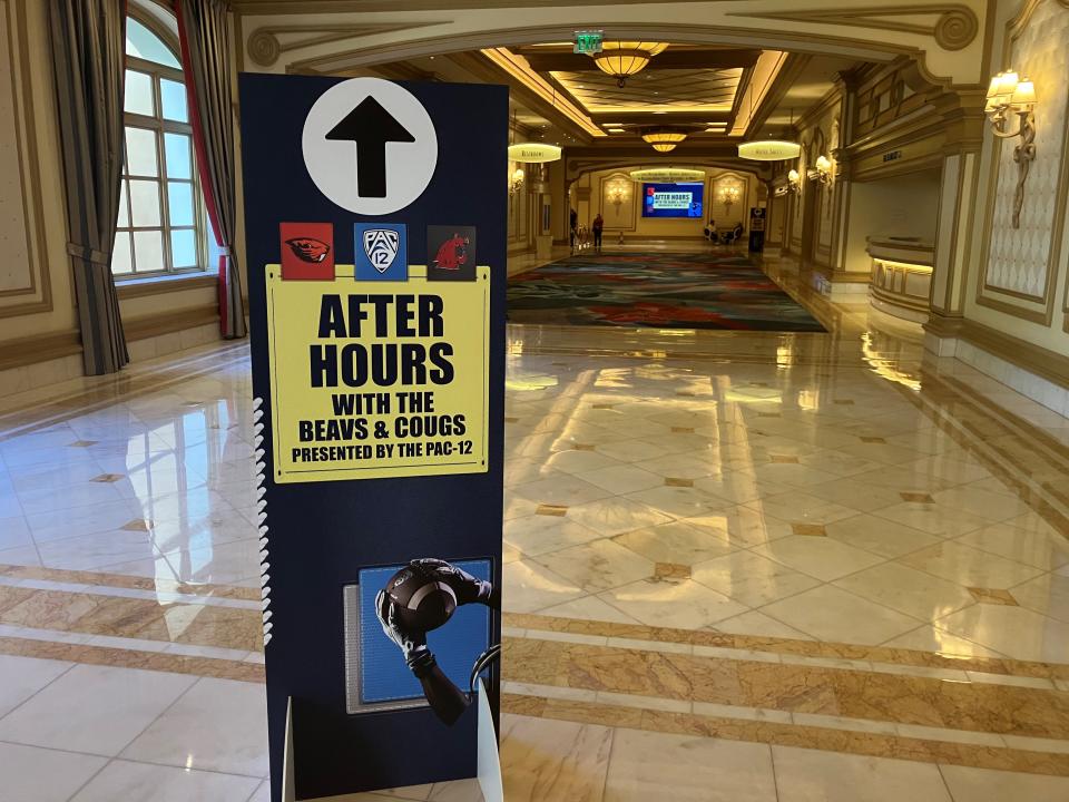 A sign in a lonely hotel hallway directs members of the media to the small Pac-12 event on Wednesday night in Las Vegas. Brent Schrotenboer, USA TODAY Sports