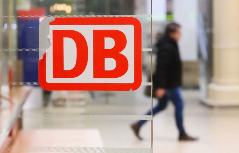 A scratched Deutsche Bahn DB logo is stuck up at Hanover Central Station. The German Train Drivers' Union (GDL) has called for another strike at Deutsche Bahn lasting several days. Julian Stratenschulte/dpa
