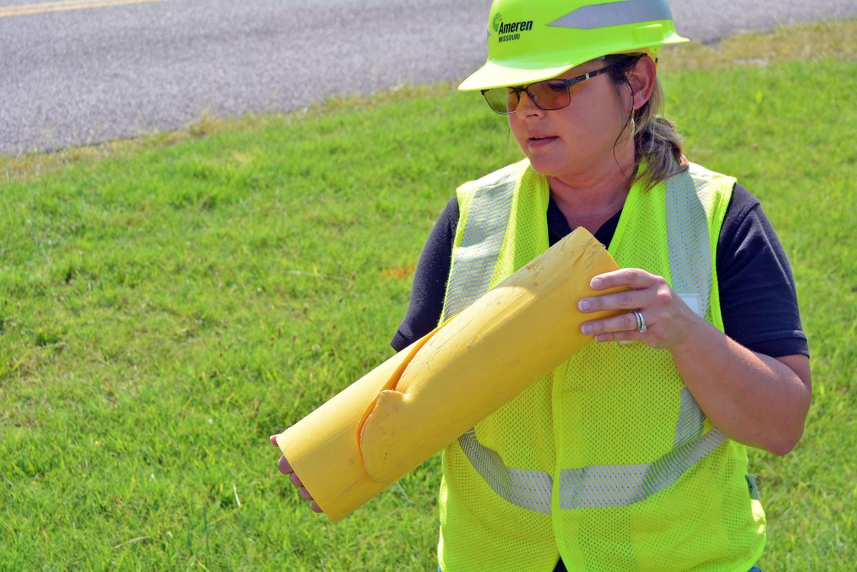 Ramona Schatzer, with Ameren Missouri, shows off Monday where a gas pipe was damaged by a backhoe. Ameren Missouri and Missouri 811 are partnering on the '50-in-5 Initiative' which aims to raise awaress on digging safe and reducing damange to utility service lines not only in roadway right-of-ways, but also on properties.