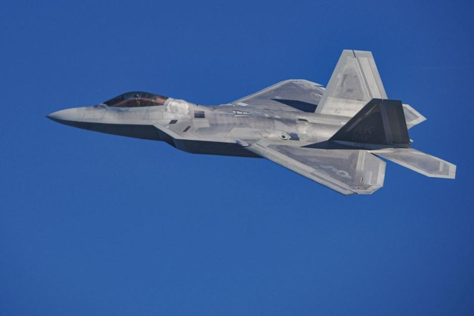 A U.S. F-22 Raptor fighter jet takes part in the NATO Air Shielding exercise near the air base in Lask in central Poland on Oct. 12, 2022.<span class="copyright">Radoslaw Jozwiak–AFP/Getty Images</span>