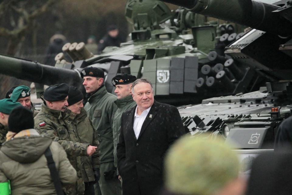 Secretary of State Mike Pompeo, center, visits NATO soldiers in Poland, on Feb. 13, 2019. Pompeo is in Poland for a summit on the Middle East.