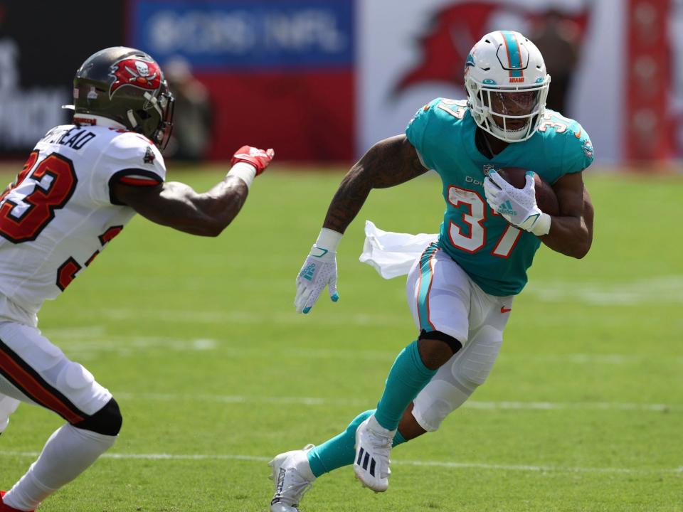 Myles Gaskin makes a play against the Tampa Bay Buccaneers.