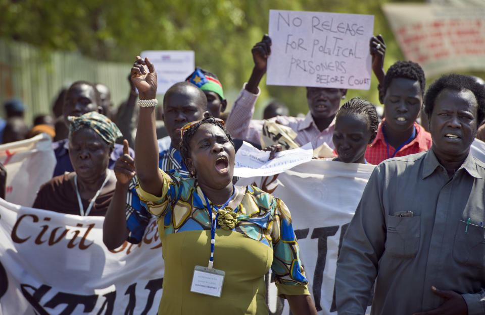 South Sudanese people take part in a peace march organised by civil society groups in the capital Juba, South Sudan Wednesday, Jan. 8, 2014. Officials in Ethiopia say peace talks for South Sudan are stalled over the issue of political prisoners, describing the talks as "on and off" after the special envoy of a bloc of East African countries known as IGAD flew to South Sudan to speak about political detainees. (AP Photo/Ali Ngethi)