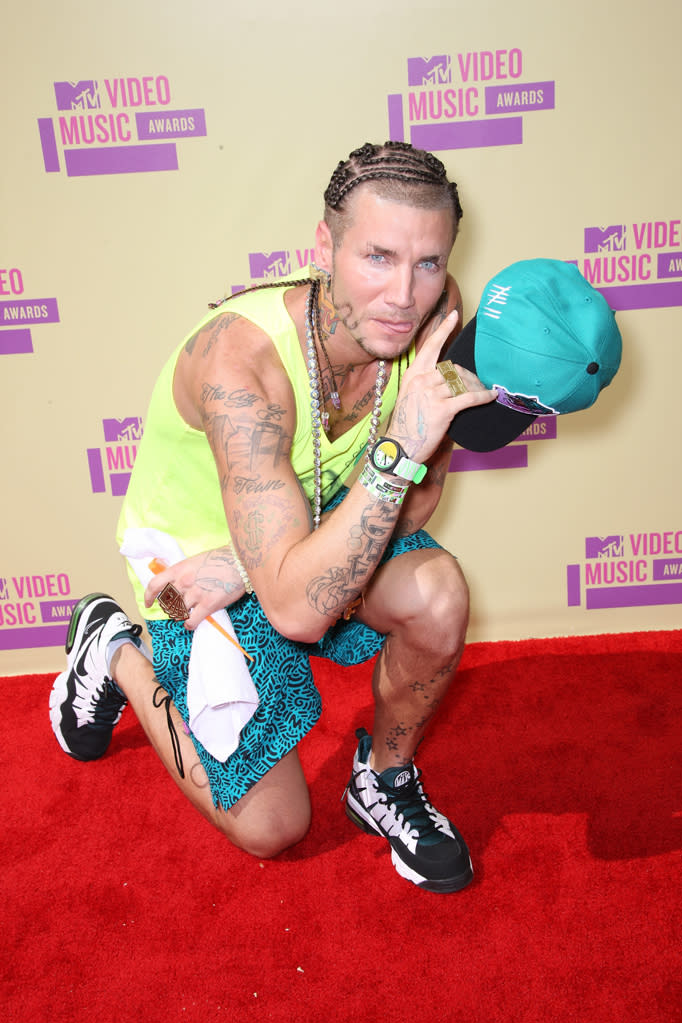 Rapper Riff Raff showed his love for MTV with an MTV-themed tank top and blingy necklace. If it weren't for those items, we would've thought he just wandered over to the awards after a day at the beach … or the tattoo parlor.