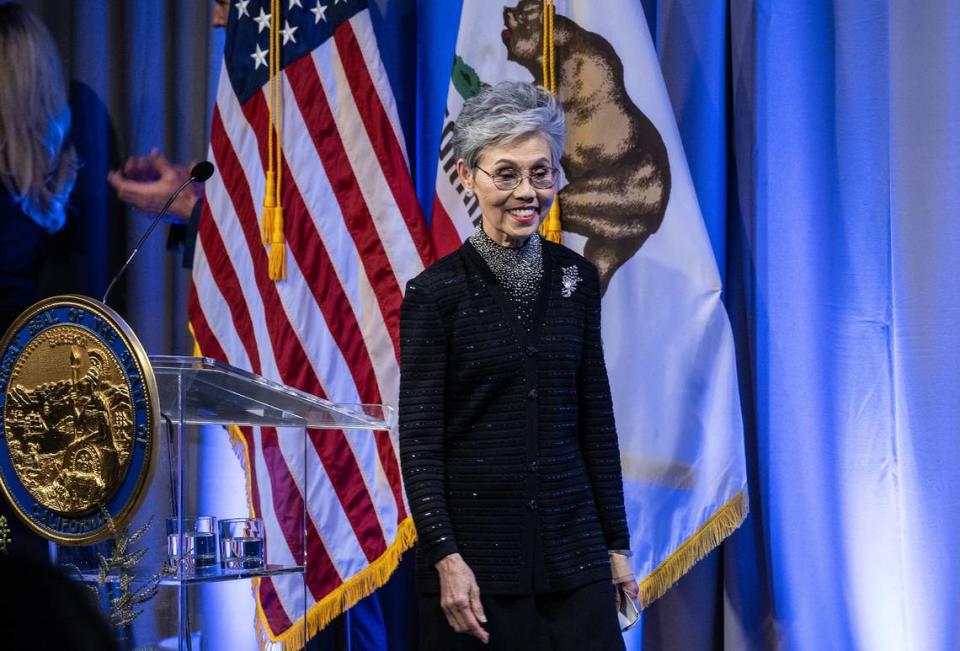 Helene An, chef and ”mother of fusion cuisine,” walks on stage before she received her medal from Gov. Gavin Newsom during the California Hall of Fame induction ceremony Tuesday, Feb. 6, 2024, in Sacramento. Hector Amezcua/hamezcua@sacbee.com