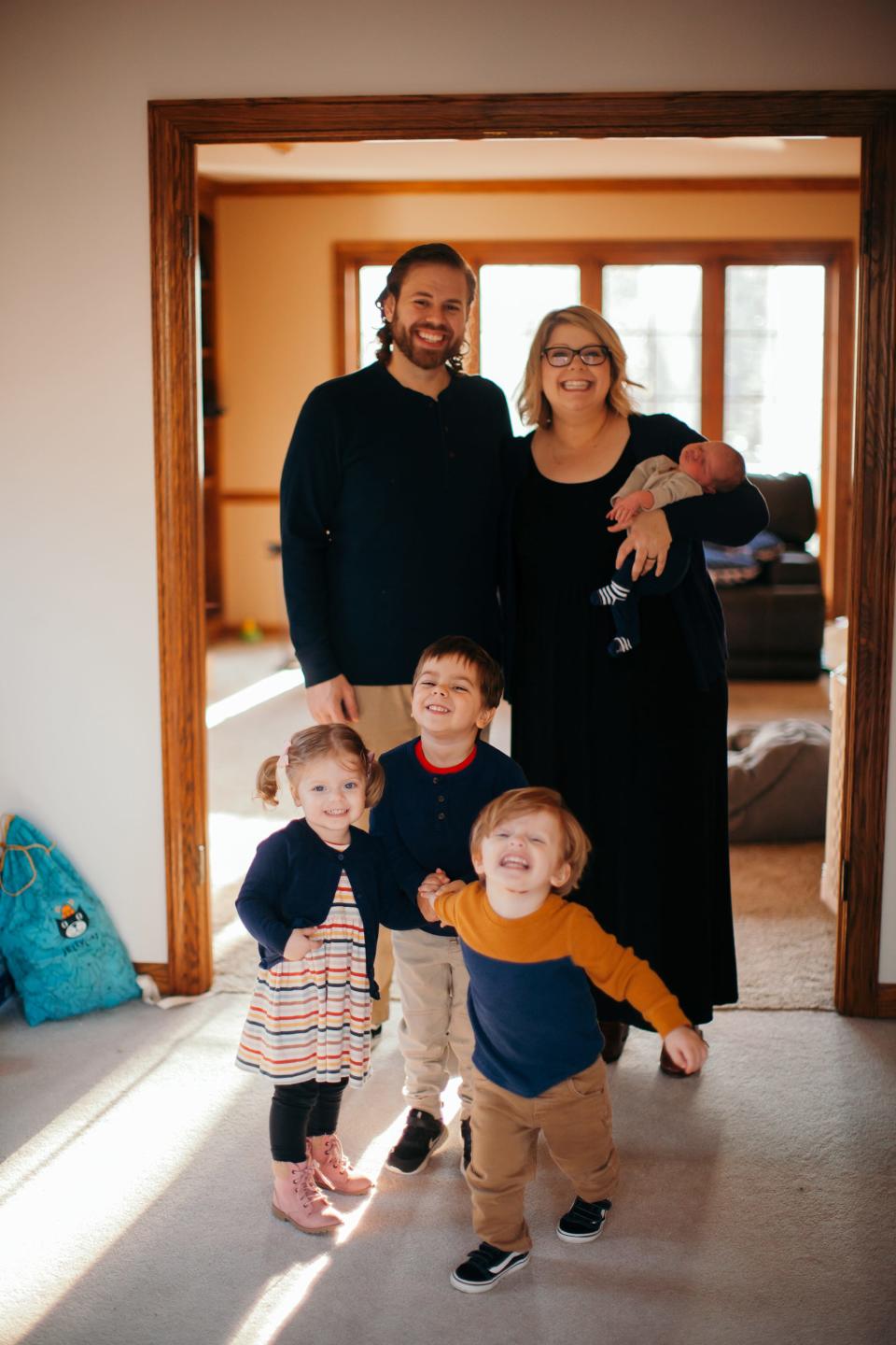 Philia Kelnhofer, shown with her husband, Nick, and four children, is a Greenfield blogger and author who advocates simple meals.