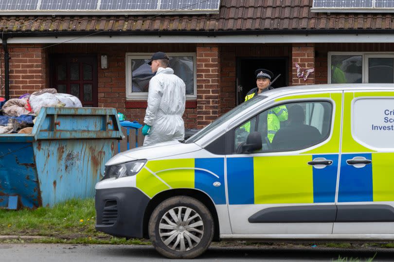 Police and forensic officers at a house in Marsh Green after the remains of a baby were found