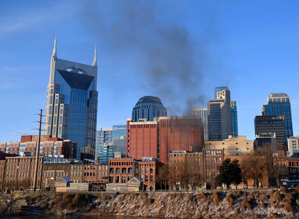 Smoke rises from downtown after an explosion in the area of Second and Commerce on Dec. 25, 2020, in Nashville, Tenn.