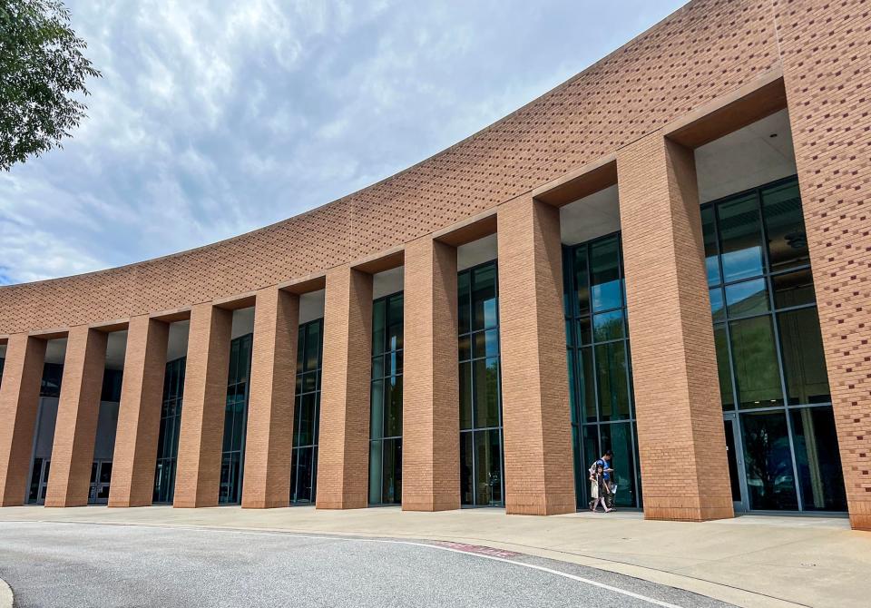 People come and go from the Greenville County Library System Hughes Main Library on Heritage Green Place in Greenville Thursday, June 23, 2022.