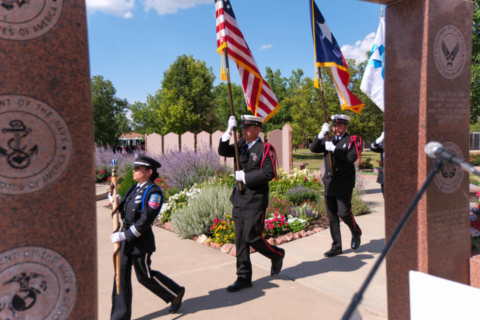 Members of the Potter County Fire Color Guard bring the colors forward at the Moving Honors Procession Wednesday at the Texas Panhandle War Memorial in Amarillo.