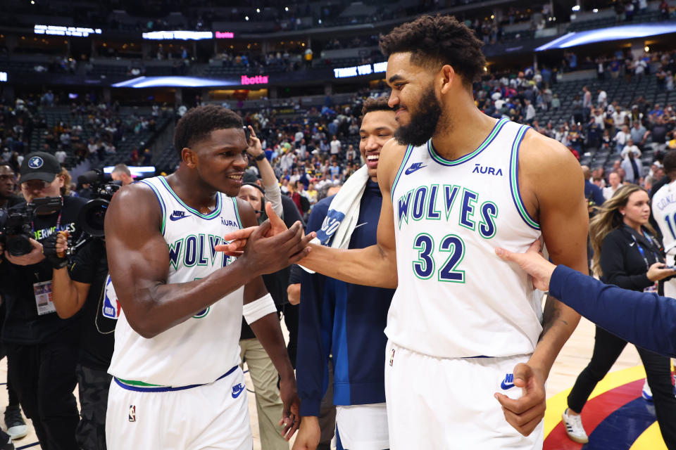 DENVER, COLORADO - MAY 19: Anthony Edwards #5 and Karl-Anthony Towns #32 of the Minnesota Timberwolves celebrate after winning Game Seven of the Western Conference Second Round Playoffs against the Denver Nuggets at Ball Arena on May 19, 2024 in Denver, Colorado. NOTE TO USER: User expressly acknowledges and agrees that, by downloading and or using this photograph, User is consenting to the terms and conditions of the Getty Images License Agreement. (Photo by C. Morgan Engel/Getty Images)