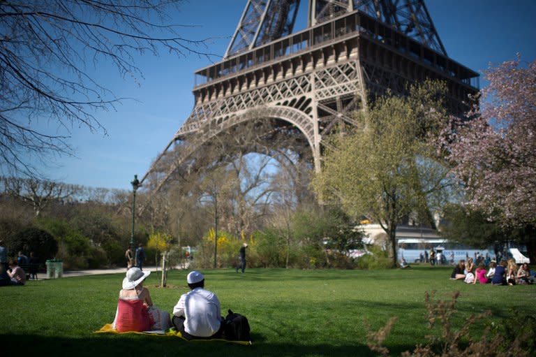 People have picnic on the grass of the Champs de Mars in Paris, on March 26, 2012. According to studies on asexuality, people who have no or little sexual appetite could make up one percent of the global population