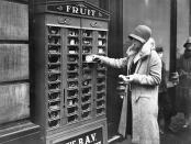 <p>A photographer captures a shopper in London, England, as she fetches a snack from a street-side vending machine.</p>