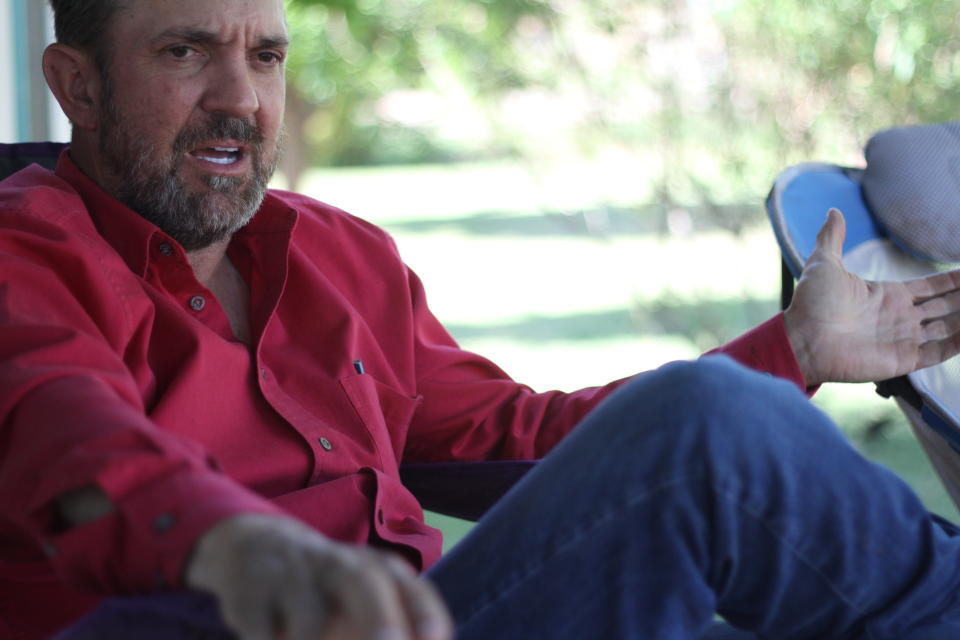 Otero County Commissioner Couy Griffin, the founder of Cowboys for Trump, discussed his past and future in politics from the porch of a tidy double-wide trailer in Tularosa, N.M., on Wednesday, May 12, 2021. Griffin is reviled and revered in politically conservative Otero County as he confronts criminal charges for joining protests on the steps of the U.S. Capitol on Jan. 6. Griffin is fighting for his political future amid a recall initiative and state probes into his finances. (AP Photo/Morgan Lee)