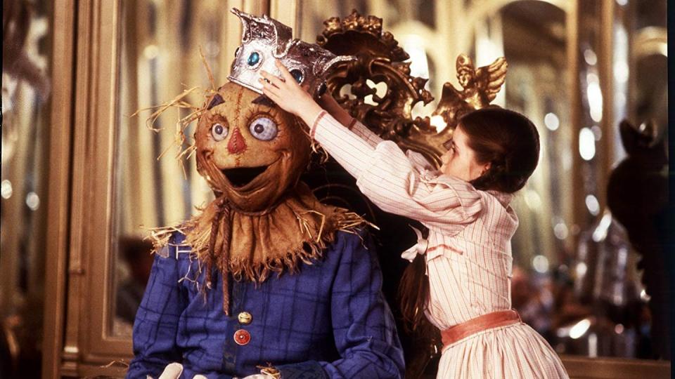 dorothy puts a crown on the scarecrow's head in a scene from 'return to oz,' a good housekeeping pick for best scary movies for kids