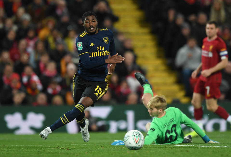 LIVERPOOL, ENGLAND - OCTOBER 30: Ainsley Maitland-Niles rounds Caoimhin Kelleher of Liverpool on his way to scoring Arsenal's 4th goal during the Carabao Cup Round of 16 match between Liverpool and Arsenal at Anfield on October 30, 2019 in Liverpool, England. (Photo by David Price/Arsenal FC via Getty Images)