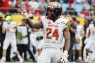 Maryland running back Roman Hemby signals a first down after a run against North Carolina State during the first half of the Duke's Mayo Bowl NCAA college football game in Charlotte, N.C., Friday, Dec. 30, 2022. (AP Photo/Nell Redmond)