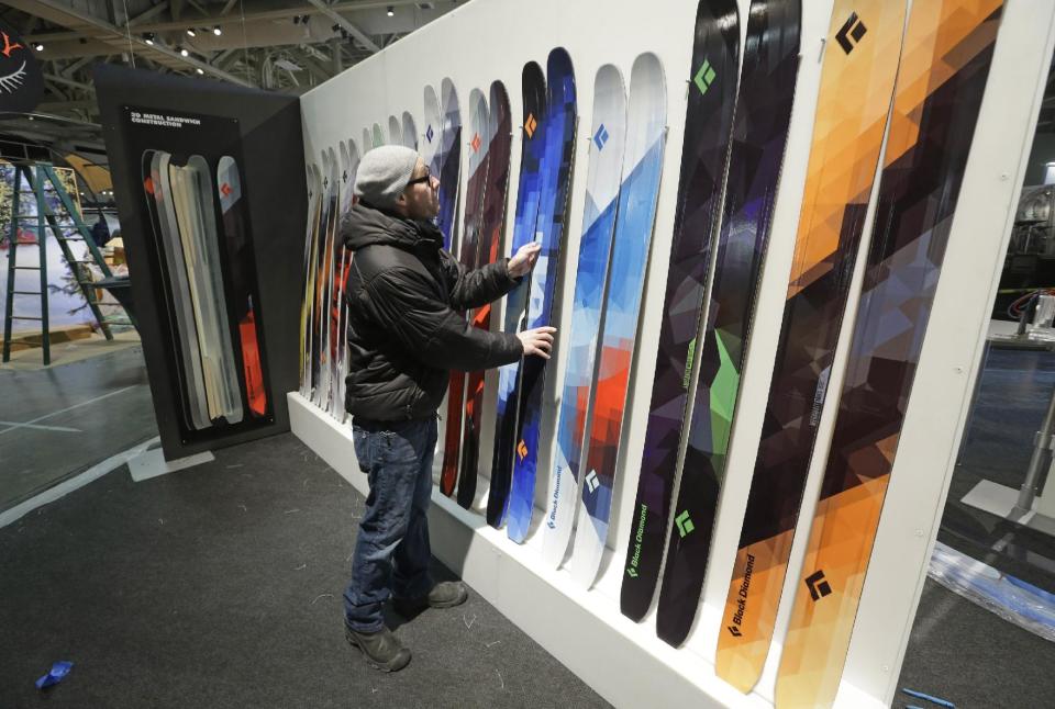 Matt Law sets up the Black Diamond display at the Outdoor Retailer show Tuesday, Jan. 22, 2013, in Salt Lake City. The Outdoor Retailer show, which kicks off this Wednesday at the Salt Palace Convention Center, draws more than 25,000 people and pours more than $40 million into Utah’s economy every year. One of the world's largest outdoor gear trade shows will remain in Salt Lake City at least through 2016. The shows were previously contracted to stay through 2014. (AP Photo/Rick Bowmer)