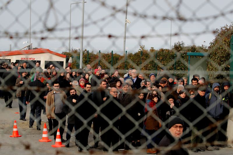 Friends and supporters of the defendants line up to enter the courtroom at the Silivri Prison and Courthouse complex in Silivri near Istanbul