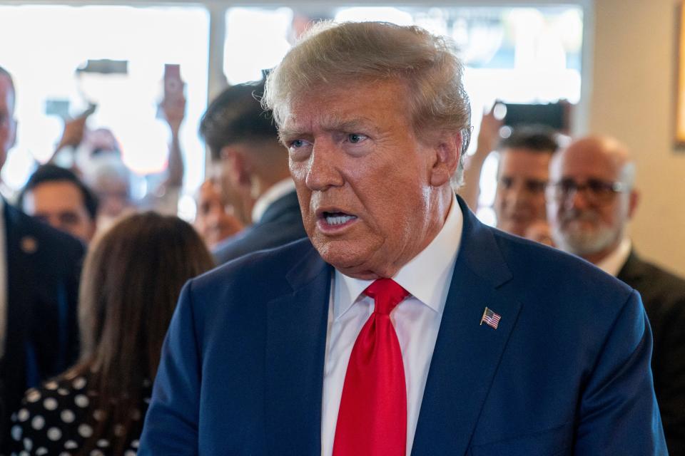 Former President Donald Trump speaks to the media as he visits Versailles restaurant on Tuesday, June 13, 2023, in Miami. Trump appeared in federal court Tuesday on dozens of felony charges accusing him of illegally hoarding classified documents and thwarting the Justice Department's efforts to get the records back.