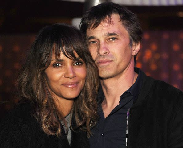 <p>Joshua Blanchard/Getty</p> Halle Berry (L) and Olivier Martinez attend the Treats! Magazine Pre-Oscar Party at the Treats! Villa presented by OMNIA on February 21, 2015 in Los Angeles, California.