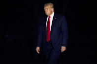 FILE - In this July 10, 2020, file photo President Donald Trump walks across the South Lawn of the White House in Washington as he returns from a trip to Florida. (AP Photo/Andrew Harnik, File)