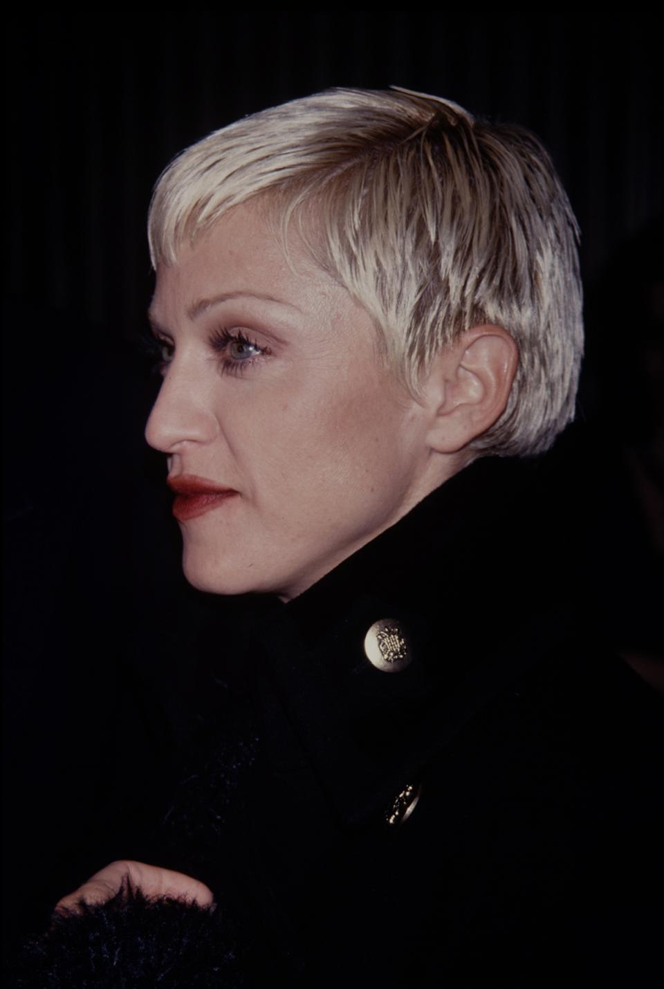 This bleached pixie is definitely the shortest we’ve seen Madonna’s hair, but she still pulls of the look with her sculpted cheekbones.