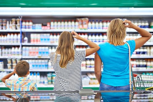 <span class="caption">Shopping during an inflationary uptick can require a bit more thought. </span> <span class="attribution"><a class="link " href="https://www.shutterstock.com/image-photo/mother-children-choosing-dairy-products-shop-479459437" rel="nofollow noopener" target="_blank" data-ylk="slk:Sergey Ryzhov / Shutterstock;elm:context_link;itc:0;sec:content-canvas">Sergey Ryzhov / Shutterstock</a></span>