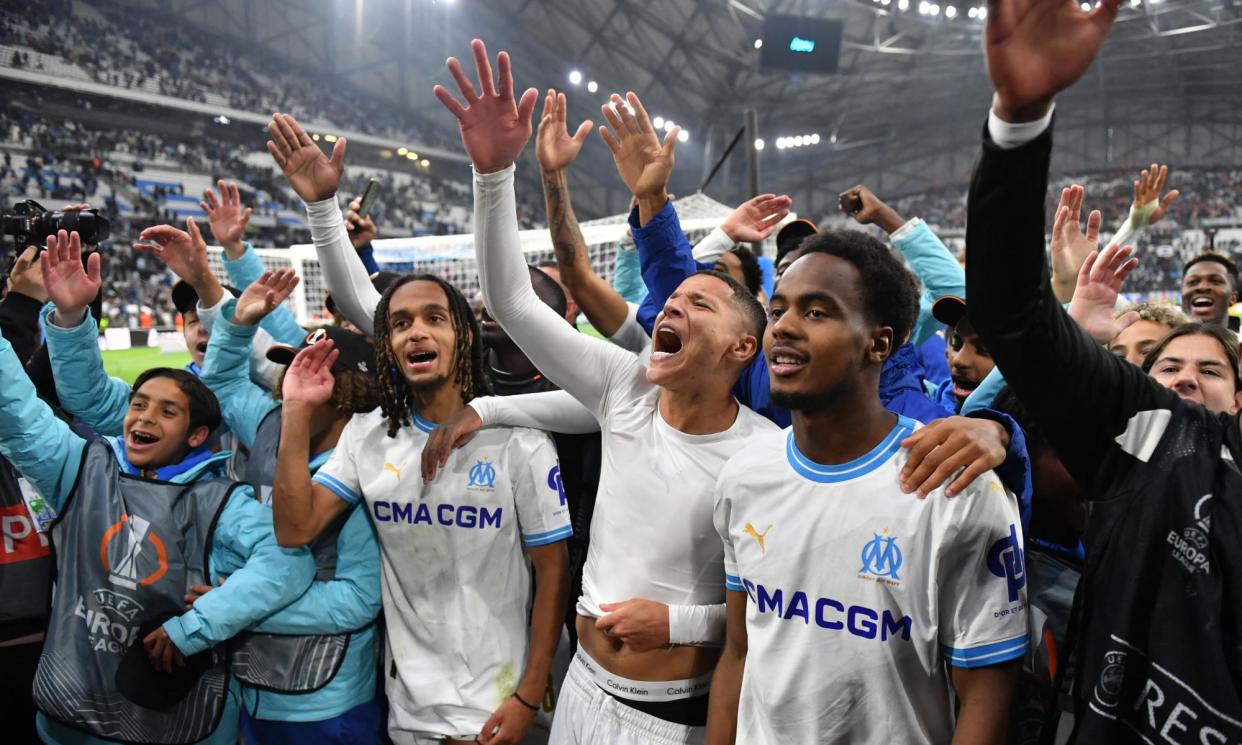 <span>Marseille’s Moroccan French midfielder Amine Harit (centre) and teammates celebrate after the Europa League quarter-final second leg against Benfica at Stade Vélodrome.</span><span>Photograph: Sylvain Thomas/AFP/Getty Images</span>