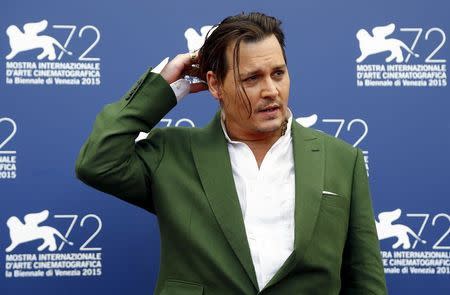 Actor Johnny Depp poses during a photocall for the movie "Black Mass" at the 72nd Venice Film Festival in northern Italy September 4, 2015. REUTERS/Stefano Rellandini