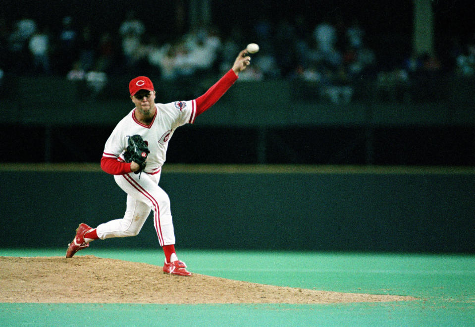 FILE - Cincinnati Reds pitcher Tom Browning delivers a pitch during a game against the Los Angeles Dodgers at Riverfront Stadium in Cincinnati, Sept. 16, 1988. Browning threw a perfect game as the Reds won 1-0. Browning, an All-Star pitcher who threw the only perfect game in Cincinnati Reds history and helped them win a World Series title, died on Monday, Dec. 19, 2022. He was 62. (AP Photo, File)