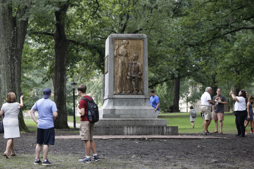 People gather around the remainder of the Silent Sam monument after it was toppled from its pedestal by protesters at the University of North Carolina in Chapel Hill in August. Early Tuesday morning, the remainder of the monument was taken down. (Photo: ASSOCIATED PRESS)