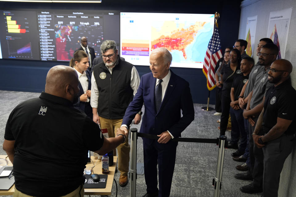 President Joe Biden greets people during a visit to the D.C. Emergency Operations Center, Tuesday, July 2, 2024, in Washington. (AP Photo/Evan Vucci)