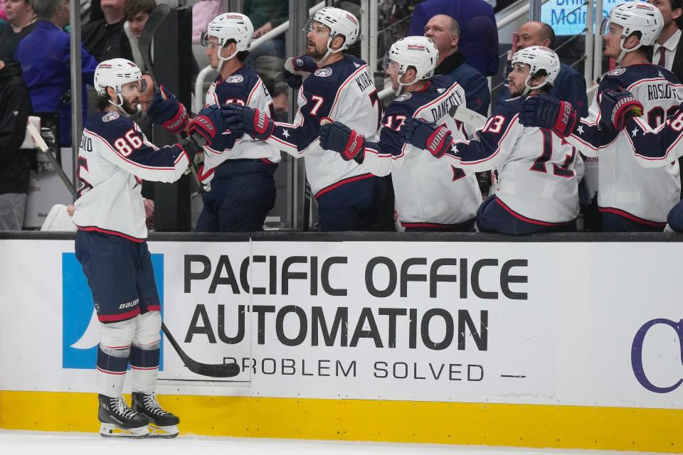 Columbus Blue Jackets right wing Kirill Marchenko (86) is congratulated for his goal against the San Jose Sharks during the first period of an NHL hockey game in San Jose, Calif., Saturday, Feb. 17, 2024. (AP Photo/Jeff Chiu)