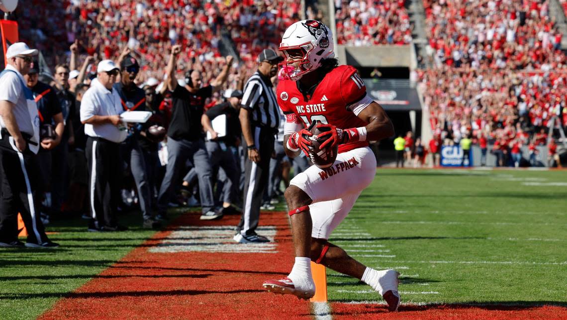 N.C. State wide receiver KC Concepcion (10) scores on a nine-yard touchdown reception during the first half of N.C. State’s game against Clemson at Carter-Finley Stadium in Raleigh, N.C., Saturday, Oct. 28, 2023. Ethan Hyman/ehyman@newsobserver.com