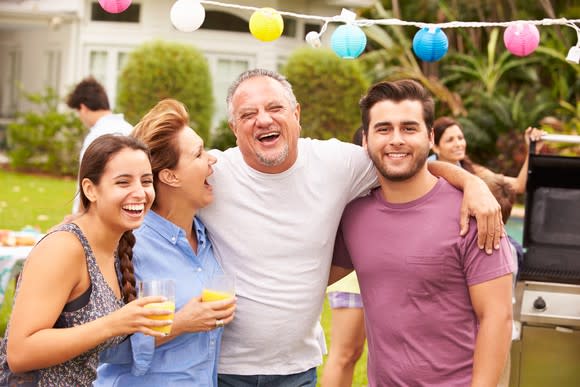 Parents with adult children at an outdoor party