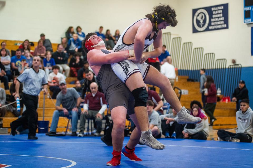 Red Hook's Luke Daniels, left, wrestles New Paltz's Logan Ormond in the 285 pound weight class during the division 2 Section 9 wrestling championship at SUNY Ulster in Stone Ridge, NY on Sunday, February 12, 2023. Red Hook's Luke Daniels won the match.