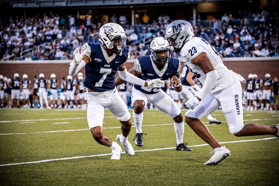 University of New Hampshire cornerback Jonathan Collins Jr. (7) defends Monmouth's Jyair Thomas during the season-opening game in Durham Thursday, Sept. 1, 2022 at Wildcat Stadium.