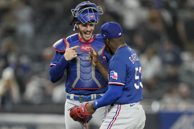 García's 2-run homer in the 10th lifts the Rangers over the struggling