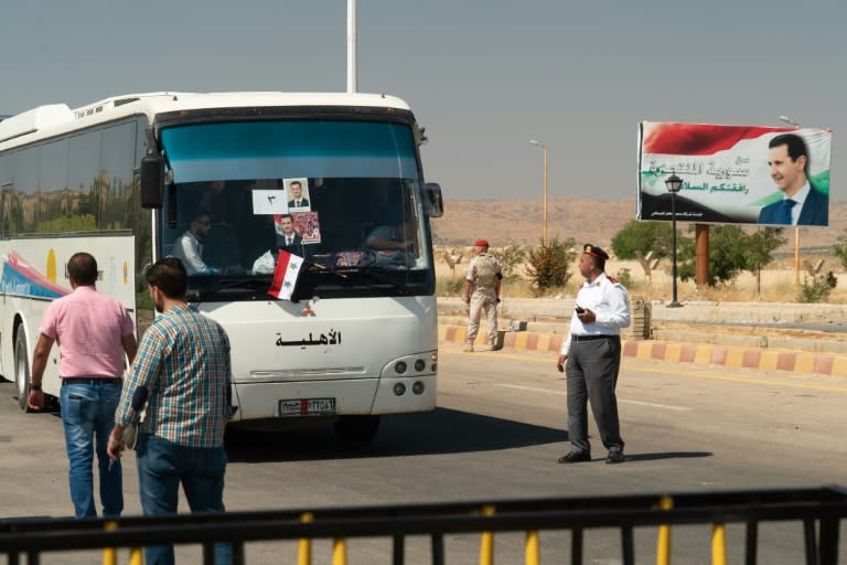 A bus transports Syrian refugees back from neighbouring Lebanon through the Jdeidat Yabus border crossing on August 13