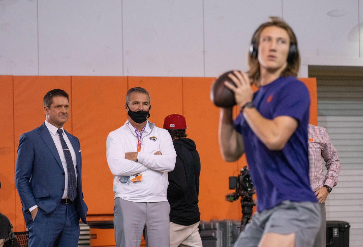 Jacksonville Jaguars head coach Urban Meyer (middle) watches as Clemson Tigers quarterback Trevor Lawrence works out during pro day in Clemson, South Carolina in February. (David Platt/Handout Photo via USA TODAY Sports)