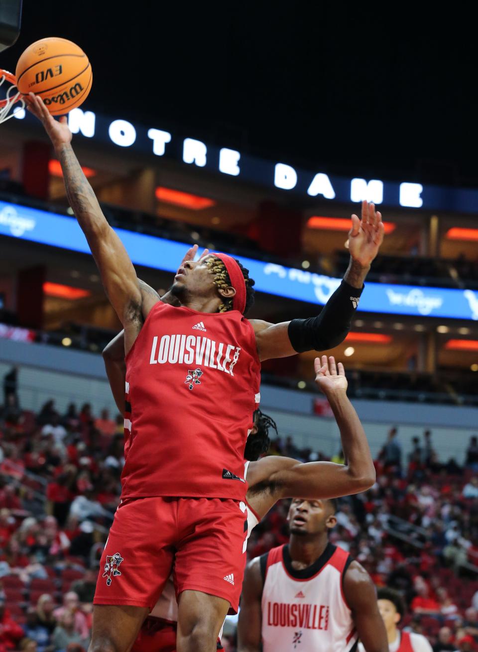 U of L’s El Ellis (3) scored against the defense during their red/white scrimmage at the Yum Center in Louisville, Ky. on Oct. 23, 2022.  